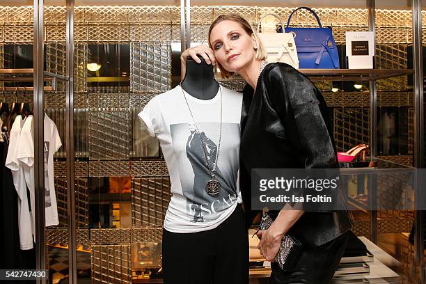 German model Nadja Auermann with her charity shirt during the ESCADA Flagship Store Opening on June 23, 2016 in Duesseldorf, Germany.