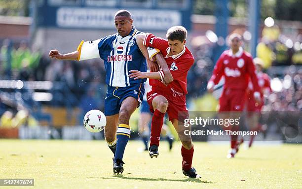 Liverpool striker Michael Owen challenges Sheffield Wednesday defender Des Walker during an FA Carling Premiership match between Sheffield Wednesday...