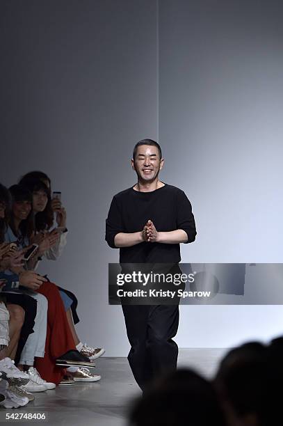 Juun.J acknowledges the audience during the Juun.J Menswear Spring/Summer 2017 show as part of Paris Fashion Week on June 24, 2016 in Paris, France.