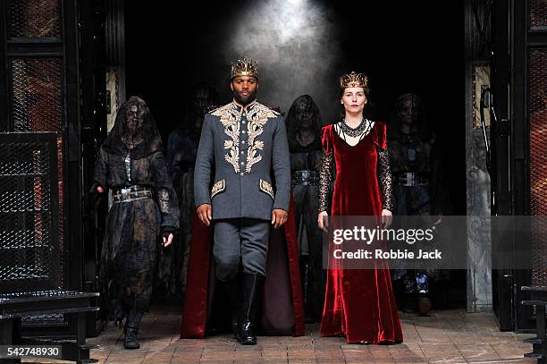 Ray Fearon as Macbeth and Tara Fitzgerald as Lady Macbeth with artists of the company in William Shakespeare's Macbeth directed by Iqban Khan at The...