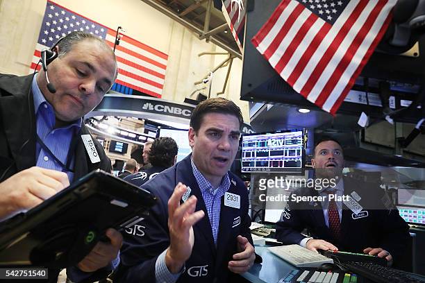Traders work on the floor of the New York Stock Exchange following news that the United Kingdom has voted to leave the European Union on June 24,...