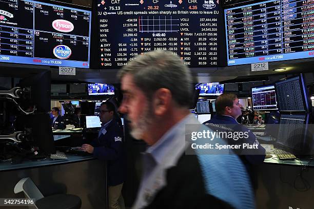 Traders work on the floor of the New York Stock Exchange following news that the United Kingdom has voted to leave the European Union on June 24,...