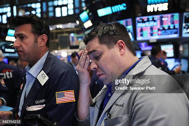 Traders work on the floor of the New York Stock Exchange following news that the United Kingdom has voted to leave the European Union on June 24,...