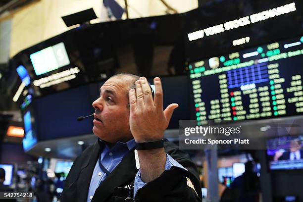 Traders work on the floor of the New York Stock Exchange following news that the United Kingdom has voted to leave the European Union on June 24,...