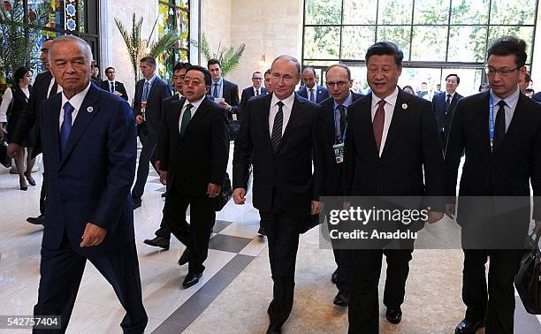 Russia's President Vladimir Putin , China's President Xi Jinping , Uzbekistan's President Islam Karimov arrive a meeting of the Shanghai Cooperation...