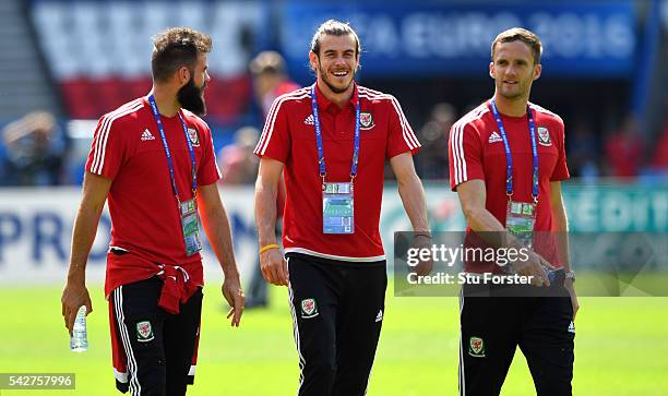 Wales players Joe Ledley Gareth Bale and Andy King share a joke during Wales Open Session prior to their Euro 2016 match against Northern Ireland at...