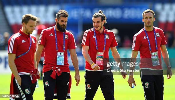 Wales players Chris Gunter Joe Ledley Gareth Bale and Andy King share a joke during Wales Open Session prior to their Euro 2016 match against...