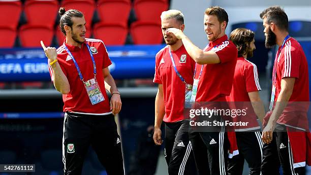 Wales players Gareth Bale and Chris Gunter get their bearings during Wales Open Session prior to their Euro 2016 match against Northern Ireland at...