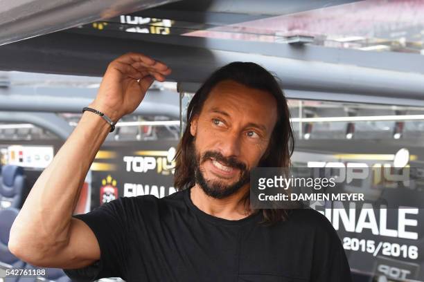French Disc Jockey Christophe Le Friant aka Bob Sinclar gestures as he poses before the French Top14 rugby union final match Toulon vs Racing 92 at...