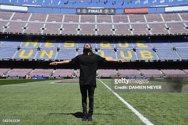 French Disc Jockey Christophe Le Friant aka Bob Sinclar poses on the pitch of the Camp Nou stadium before the French Top14 rugby union final match...