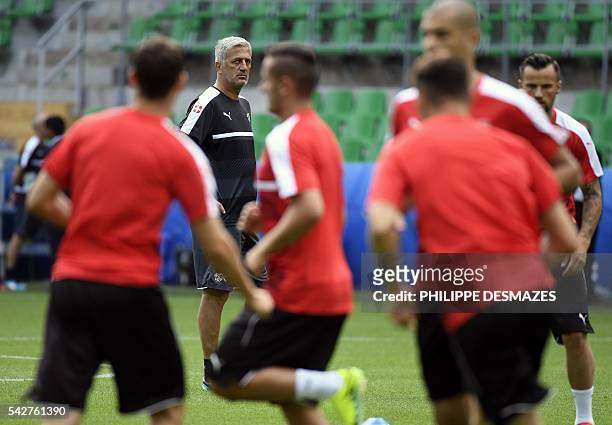 Switzerland's coach Vladimir Petkovic watches his players during a training session at the Geoffroy Guichard stadium in Saint-Etienne, France, on...
