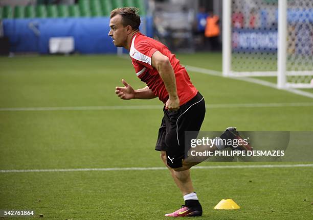 Switzerland's midfielder Xherdan Shaqiri attends a training session at the Geoffroy Guichard stadium in Saint-Etienne, France, on June 24, 2016 on...