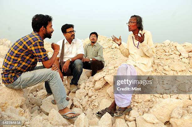 Santiniketan based artist Sanchayan Ghosh with his two students Soumyadipta and Sanjeeb and Harakumar Gupta a local folk Leto poet and singer at...