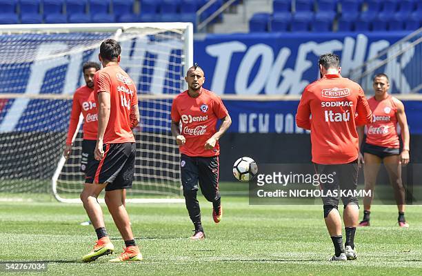 Chile's Arturo Vidal and teammates take part in a training session in Harrison, New Jersey, on June 24 two days before the Copa America final against...