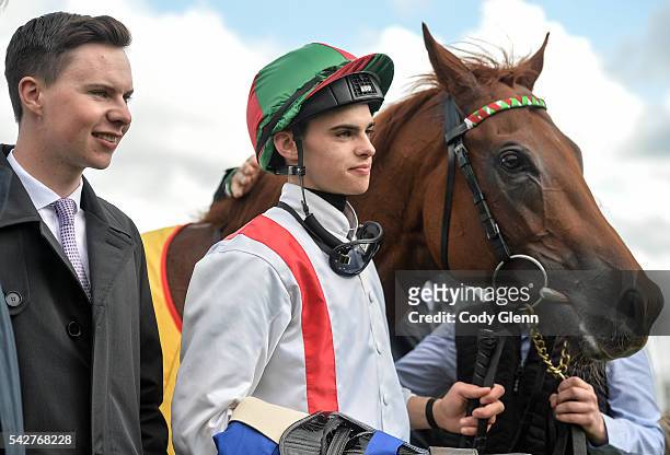 Kildare , Ireland - 24 June 2016; Trainer Joseph O'Brien, left, and jockey Donnacha O'Brien in the parade ring with Reckless Gold, after winning the...