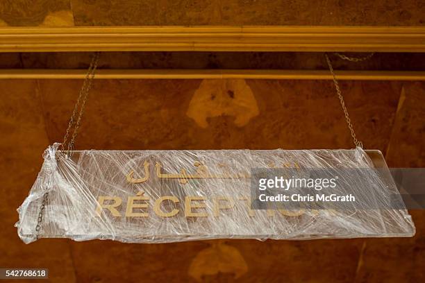 New reception sign is seen wrapped in plastic at the closed Imperial Marhaba Hotel on June 24, 2016 in Sousse, Tunisia. The Imperial Marhaba hotel...