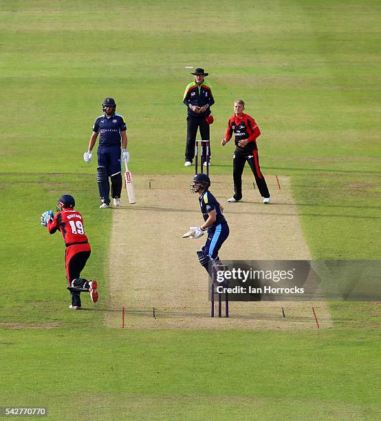 Scott Borthwick of Durham celebrates taking the wicket of Gary Ballance of Yorkshire with Phil Mustard taking the catch during the NatWest T20 Blast...