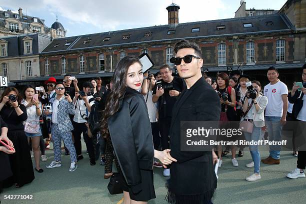 Actor Huang Xiaoming and his wife model Angelababy attend the Givenchy Menswear Spring/Summer 2017 show as part of Paris Fashion Week on June 24,...