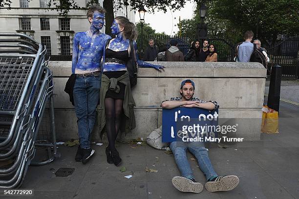 Young couple painted as EU flags protest on outside Downing Street against the United Kingdom's decision to leave the EU following the referendum on...
