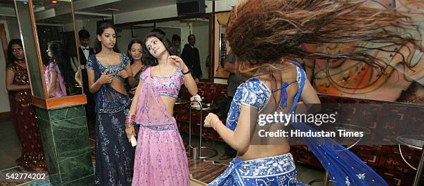 Bar girls performing dance at a bar on August 9, 2005 in Mumbai, India.