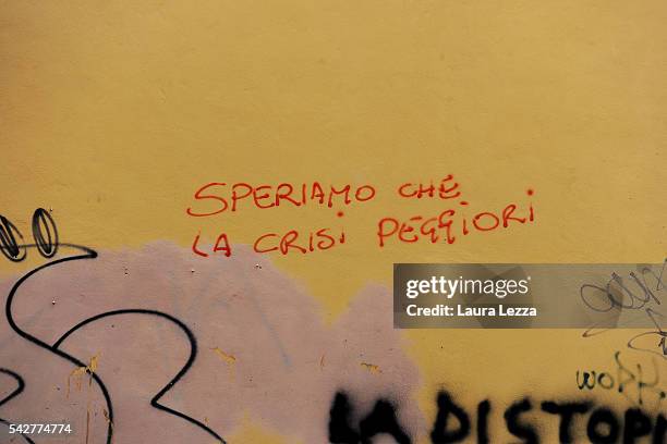 Graffiti that reads 'Speriamo che la crisi peggiori' is seen on the day of the results of the historic EU referendum on June 24, 2016 in Livorno,...