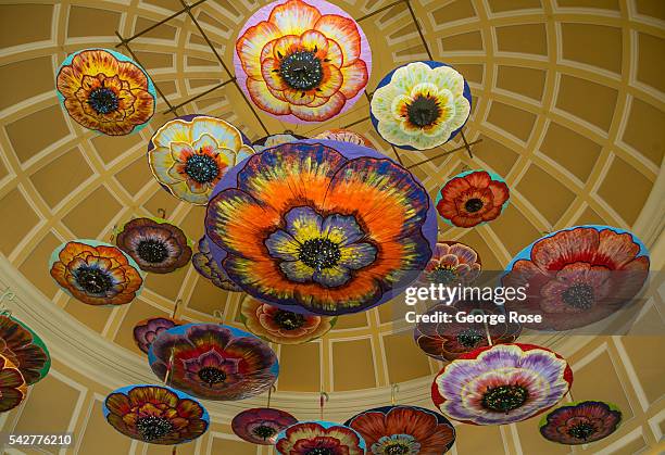 Large colorful umbrellas hang from the ceiling near the lobby of the Bellagio Hotel & Casino on June 9, 2016 in Las Vegas, Nevada. Tourism in...