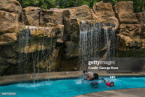 Kids and adults stay cool by floating down the "Lazy River" at Tahiti Village on June 9, 2016 in Las Vegas, Nevada. Tourism in America's "Sin City"...