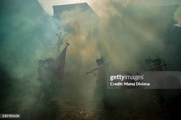 Men in traditional dress march as supporters of the La Santa Croce Azzuri Team cheer on their team before the final match of The Calcio Storico...