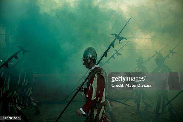 Men in traditional dress march as supporters of the La Santa Croce Azzuri Team cheer on their team before the final match of The Calcio Storico...
