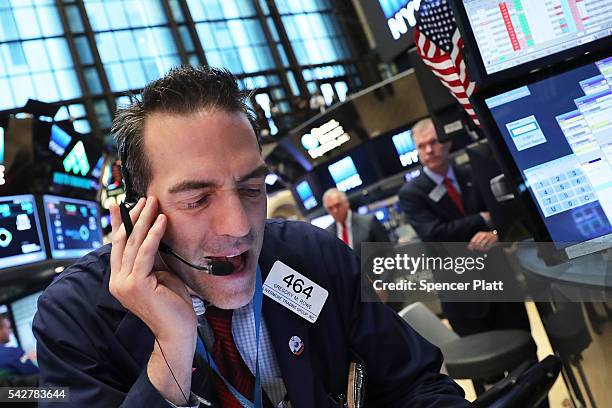 Traders work on the floor of the New York Stock Exchange following news that the United Kingdom has voted to leave the European Union on June 24,...