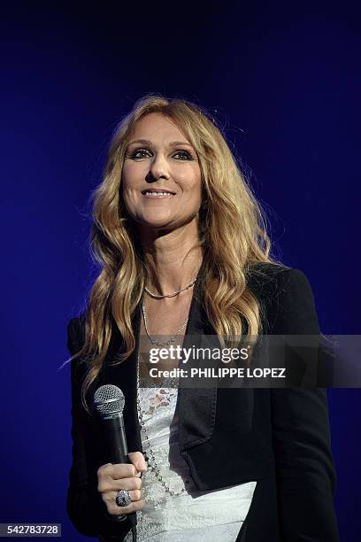 Canada's singer Celine Dion performs on stage at AccorHotels Arena concert hall in Paris on June 24, 2016. / AFP / PHILIPPE LOPEZ