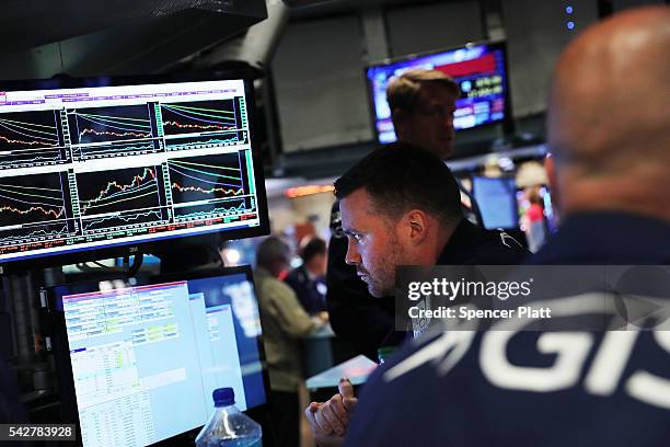 Traders work on the floor of the New York Stock Exchange following news that the United Kingdom has voted to leave the European Union on June 24,...