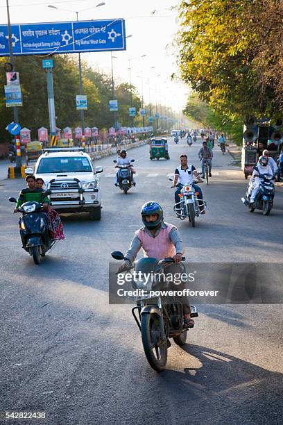 traffic on a street in agra, india - agra stock pictures, royalty-free photos & images