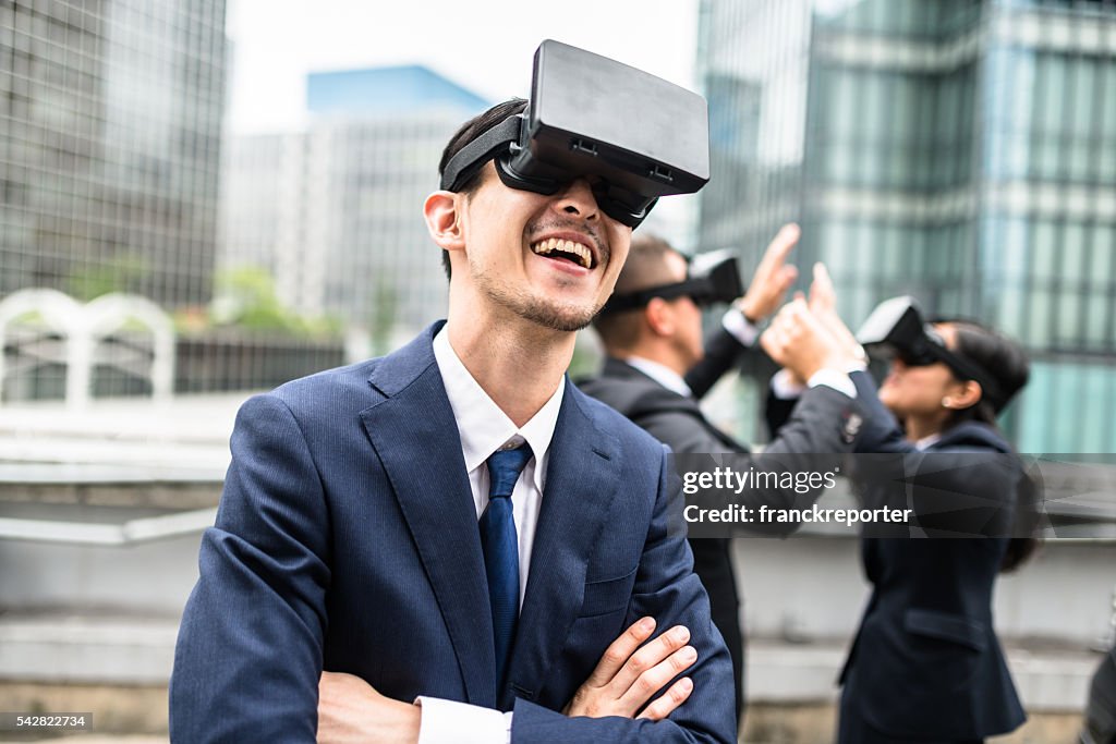 Japanese business persons using the VR simulator on the city