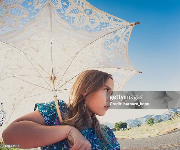 girl with parasol - lace parasol stock pictures, royalty-free photos & images