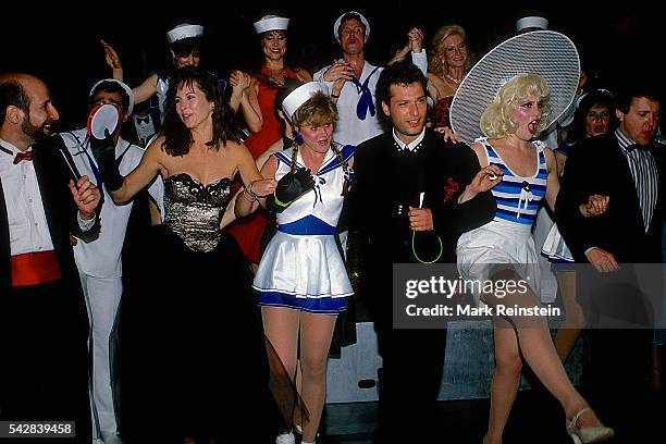 American actors Karen Kopins and Howie Mandel join a dance line, with unidentified others, during an American Cancer Ball fundraiser, Washington DC,...