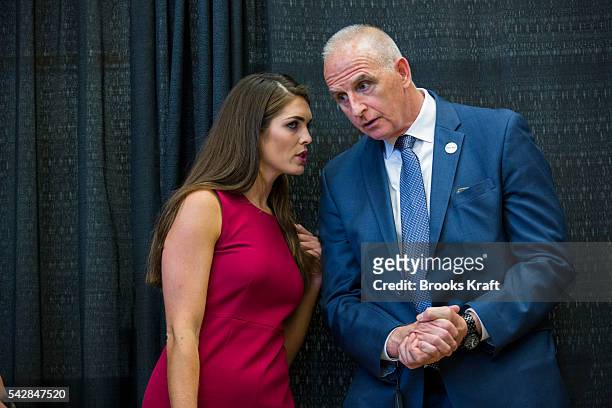 Hope Hicks, Republican Presidential candidate Donald Trump's campaign spokeswoman, speaks with with head of security Keith Schiller, at a campaign...