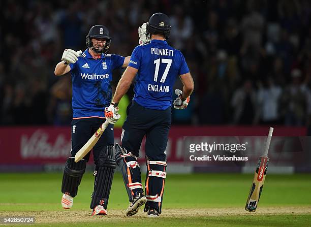 England's Chris Woakes and Liam Plunkett celebrate Plunkett hitting a final ball six to tie the match during the 1st Royal London ODI between England...