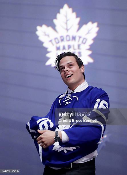Auston Matthews celebrates onstage after being selected first overall by the Toronto Maple Leafs during round one of the 2016 NHL Draft on June 24,...
