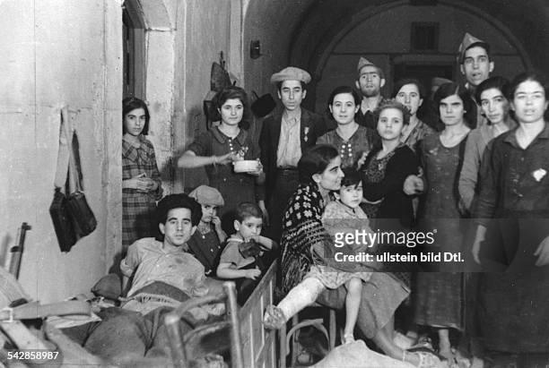 Spain La Mancha Castile Toledo: Spanish Civil War Siege of the Alcazar fortress - picture taken after the relief by Nationalist troops: group of...