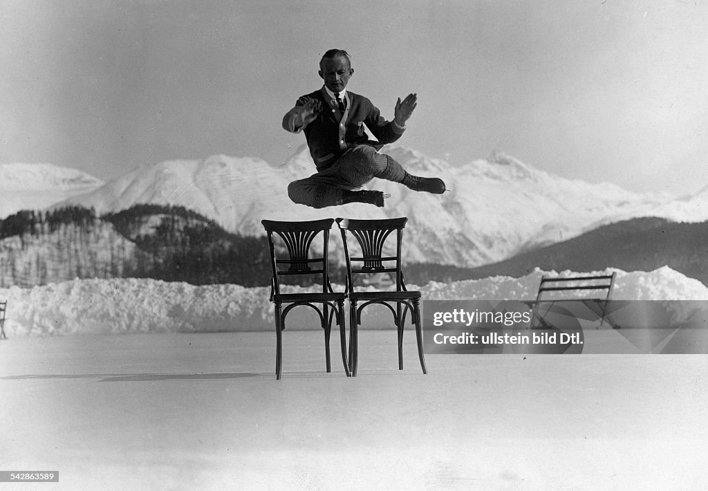 Spare time & winter sports An ice skater jumping over two chairs on an ice rink in St. Moritz - 1927 - Vintage property of ullstein bild
