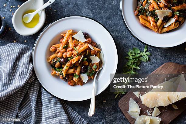 chickpea and spinach pasta - chickpea stock pictures, royalty-free photos & images