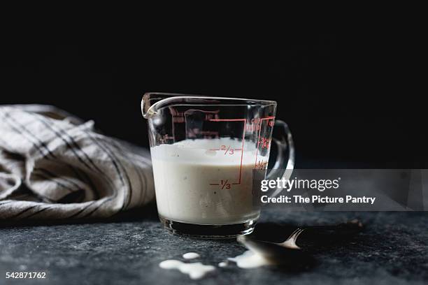 buttermilk in a jug - buttermilch stock-fotos und bilder