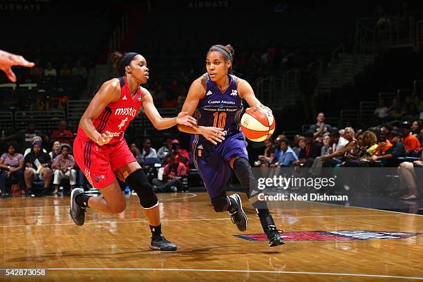 Lindsey Harding of the Phoenix Mercury handles the ball during the game against Tayler Hill of the Washington Mystics during a WNBA game on June 24,...