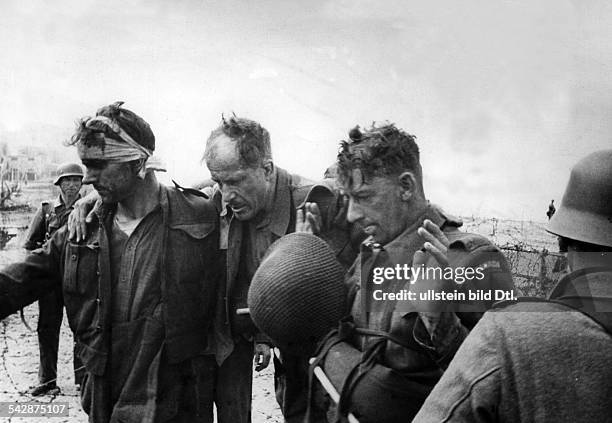 Royal Canadians taken prisoner after their surrender in the Dieppe Raid of August 19, 1942. The raid was a failure, suffering from poor planning, and...