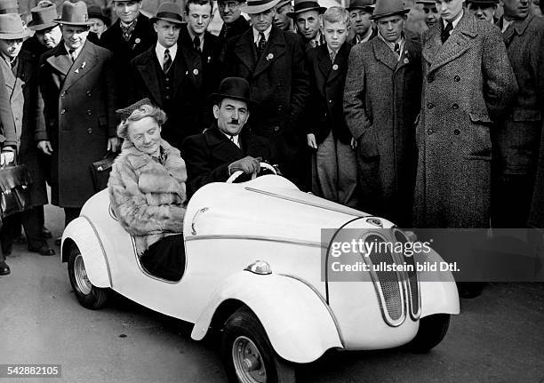 Cars Leipzig Spring Fair: the inventor of the 'Car of the Youth' sitting in the car he developed - Photographer: Heinrich Hoffmann - Vintage property...