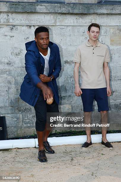 American football player Brice Butler and Model attend the Berluti Menswear Spring/Summer 2017 show as part of Paris Fashion Week on June 24, 2016 in...