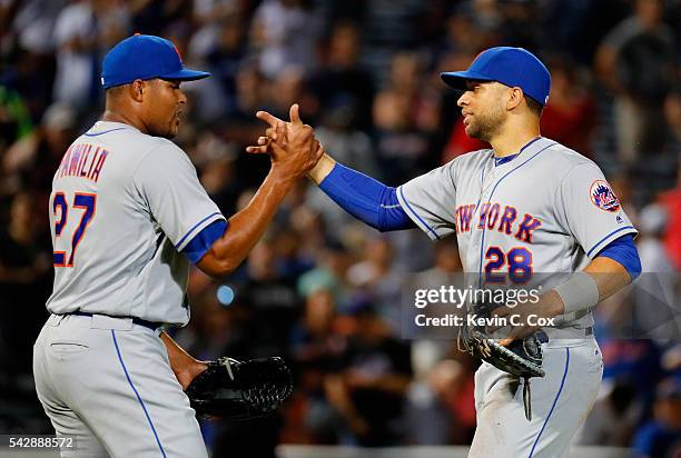 James Loney of the New York Mets reacts with Jeurys Familia after making a play to tag first base after Jace Peterson of the Atlanta Braves struck...