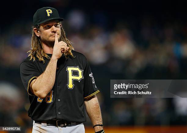 First baseman John Jaso of the Pittsburgh Pirates gestures to the fans in the eighth inning during a game against the New York Mets at Citi Field on...