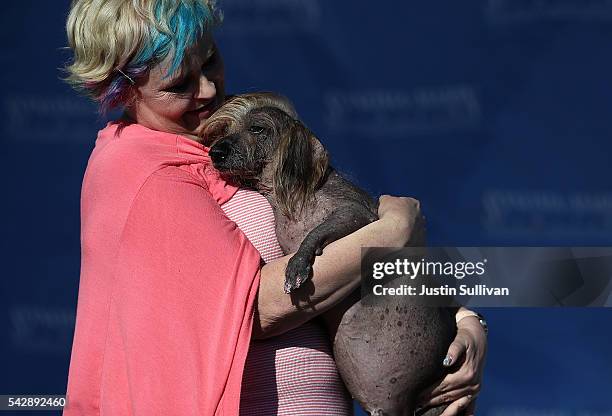 Heather Wilson of Payette, Idaho, holds her dog Himisaboo during the 2016 World's Ugliest Dog contest at the Sonoma-Marin Fair on June 24, 2016 in...